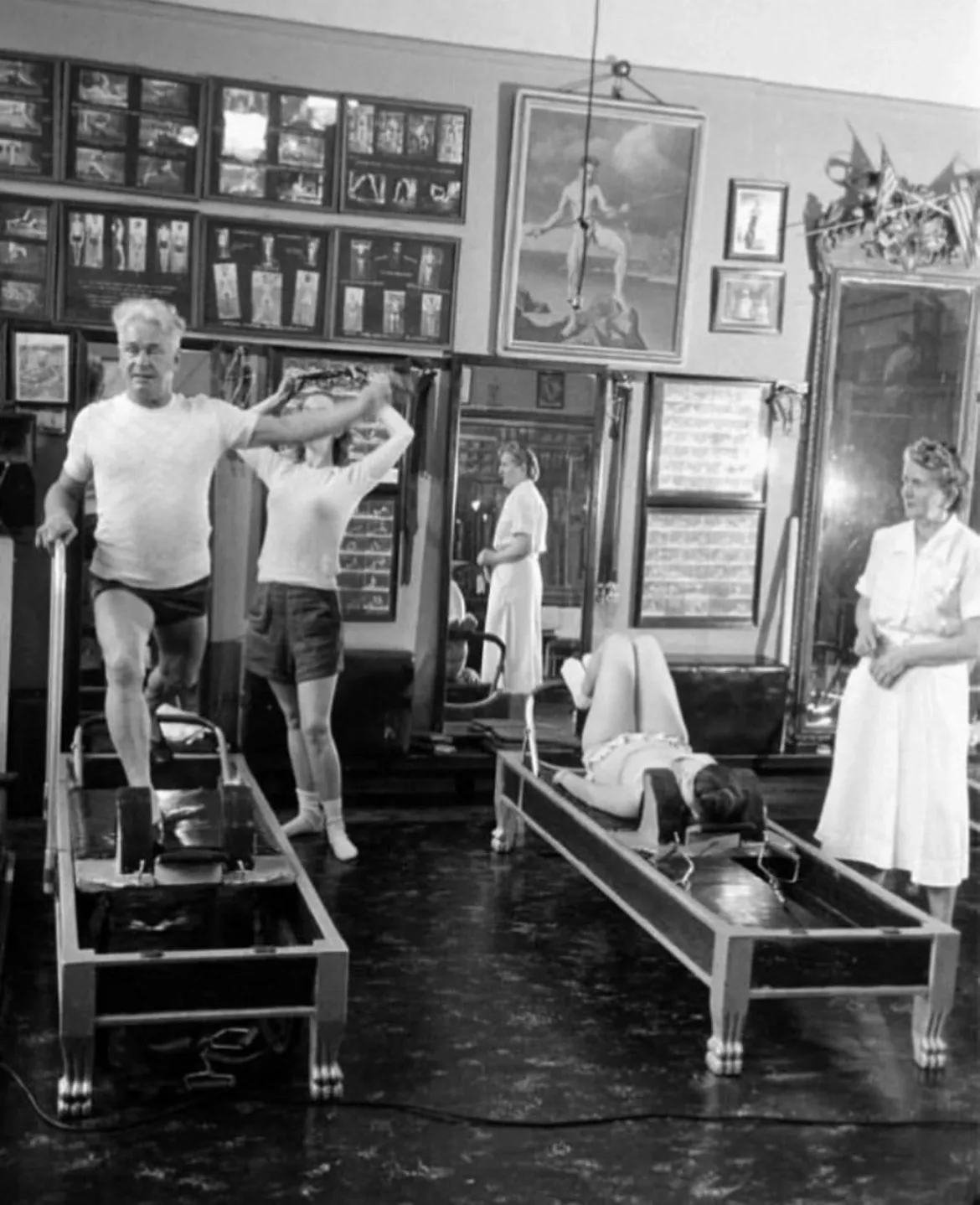 Joseph Pilates practicing on the hospital bed cadillac he invented