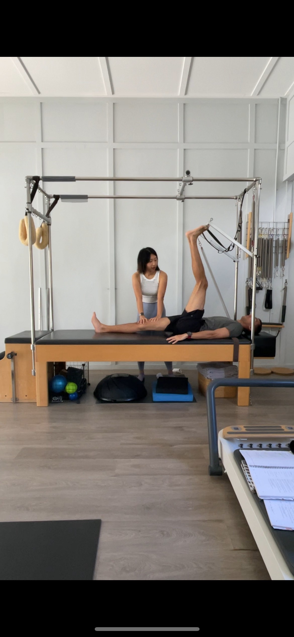 1:1 pilates instruction on a cadillac